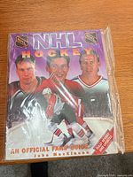 Front view of shrink-wrapped book and protector pack