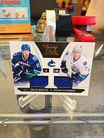 Front view of entire Panini Luxury Suite dual patch card showing both players and jersey swatches