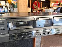 Front view of Technics RS-TR157 cassette deck on speaker