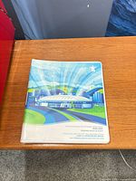 Front view of media guide binder on table