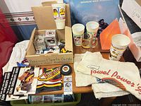 Group view showing cups, towels, box of items and patch