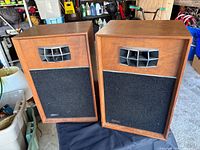 Front view of both Westinghouse speakers showing veneer, grilles and horn tweeters