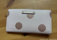 Front exterior of wallet showing polka dot design
