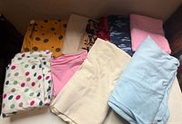 Overview of all folded fabric pieces on table