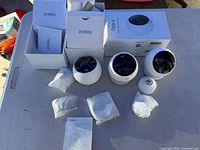 All components: three cameras, mounts, packaging, manuals