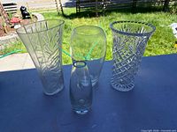 Group shot of all four vases showing size differences and designs