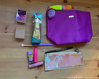 Overview of entire lot showing all cosmetics and bags