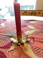 Chamberstick upright with candle inserted