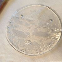 Top view of round clear pressed glass platter