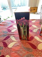 Box front showing flower vase image