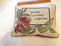 Front view of pillow showing full design and ruler for scale