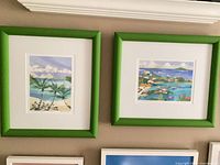 Both framed prints on wall showing full fronts