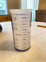 Side view showing liquid measurement scale up to 16 fl. oz.