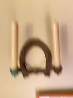 Blurry overview of wall sconce with two candles mounted