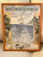 Full view of framed sheet music showing illustration and frame