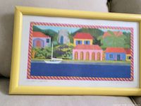 Full view of framed print showing artwork and yellow frame