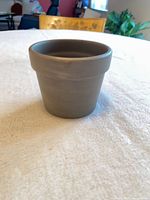 overview of gray ceramic pot showing size and shape