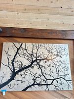 Full view of canvas showing tree branch silhouette on beige background