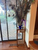 Full view of wooden mission style plant stand with square top and shelf