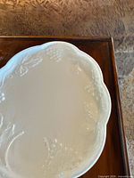 Embossed white ceramic plate detail