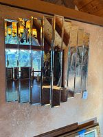 Front view showing full rectangular mirror with stepped panels