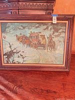 Full view of framed stagecoach winter scene painting