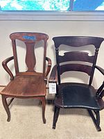 Two rocking armchairs side by side showing overall design and finish