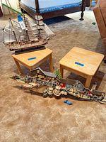 Ship model, both stools and harbor plaque overview