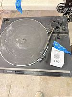 Top view of Yamaha P-520 turntable showing platter, tonearm, dust and wear