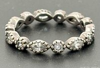 Front view of silver eternity ring with round and marquise stones