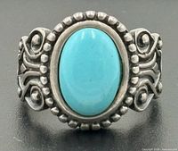 Front view of sterling silver ring with turquoise stone