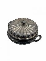 Top view of closed silver-plated tureen showing fluted lid and handles