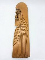 Front view of carved cedar plaque