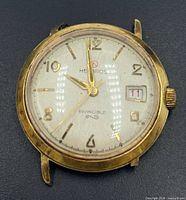 Front view showing dial, hands, date window, case condition
