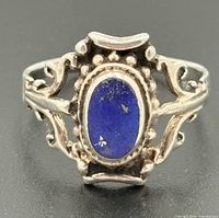 Front view of sterling silver ring with oval lapis lazuli stone