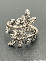 Front view of ring showing leaf motif and pavé stones