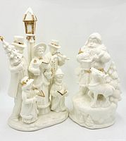 Front view of both porcelain figurines showing details and gold accents