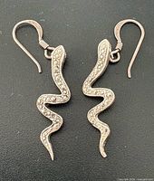 front view of both earrings showing snake shape and marcasite detailing