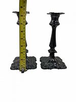 Pair of candlesticks front view with tape measure showing 8.5 in height