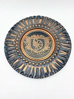 Front view showing raised Racibórz coat of arms and textured rim