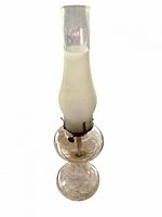 Full view of hurricane oil lamp showing glass chimney, white inner section, round font and pedestal base