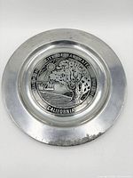 Full view of pewter plate with city seal