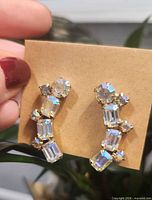 front view showing rhinestone arrangement and gold-tone setting