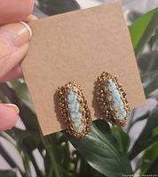 Front view of both earrings on display card