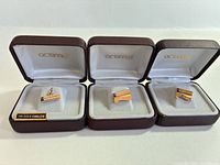 Overview of three boxed service award pieces