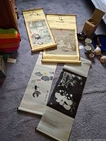 All four scrolls laid out, showing overall designs and mounts