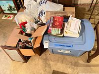 Overall lot view showing tote, boxes, cards and assorted decorations