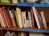 Shelf view showing majority of cookbooks in lot