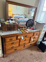 dresser with mirror atop, showing overall design, finish, hardware