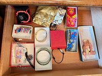 Drawer with boxed jewelry, pouches, keychain and bear frame